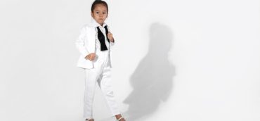 fashion-little-girl-model-white-suit-bow-tie_114963-12018