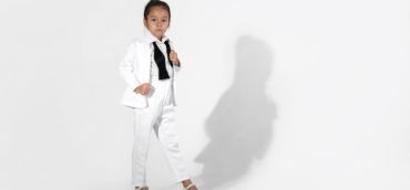 fashion-little-girl-model-white-suit-bow-tie_114963-12018